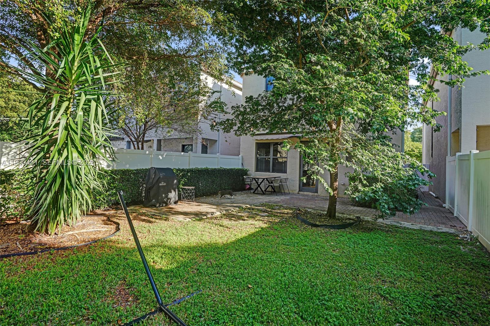 650 Northeast 193rd Terrace Miami, FL 33179 - Photo 25 of 32 a view of a house with backyard and sitting area