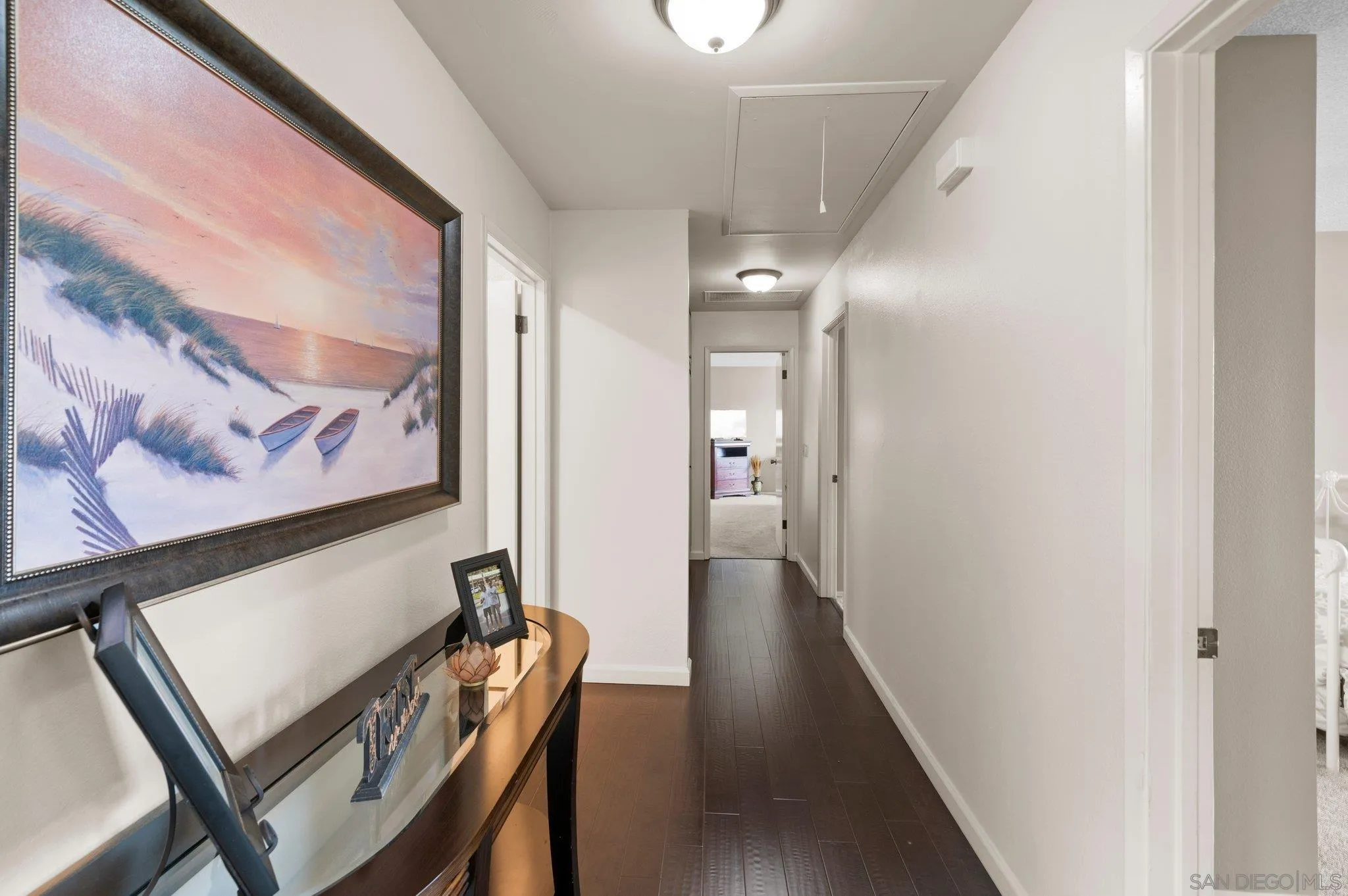 2189 Rockhoff Road Escondido, CA 92026 - Photo 30 of 60 a view of a hallway with paintings on the wall