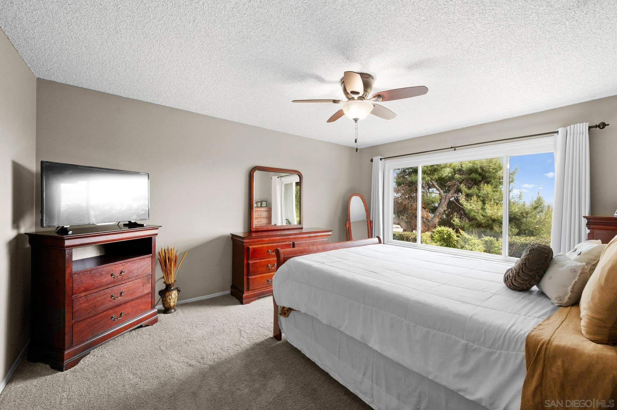 2189 Rockhoff Road Escondido, CA 92026 - Photo 31 of 60 a bedroom with a bed and a chandelier