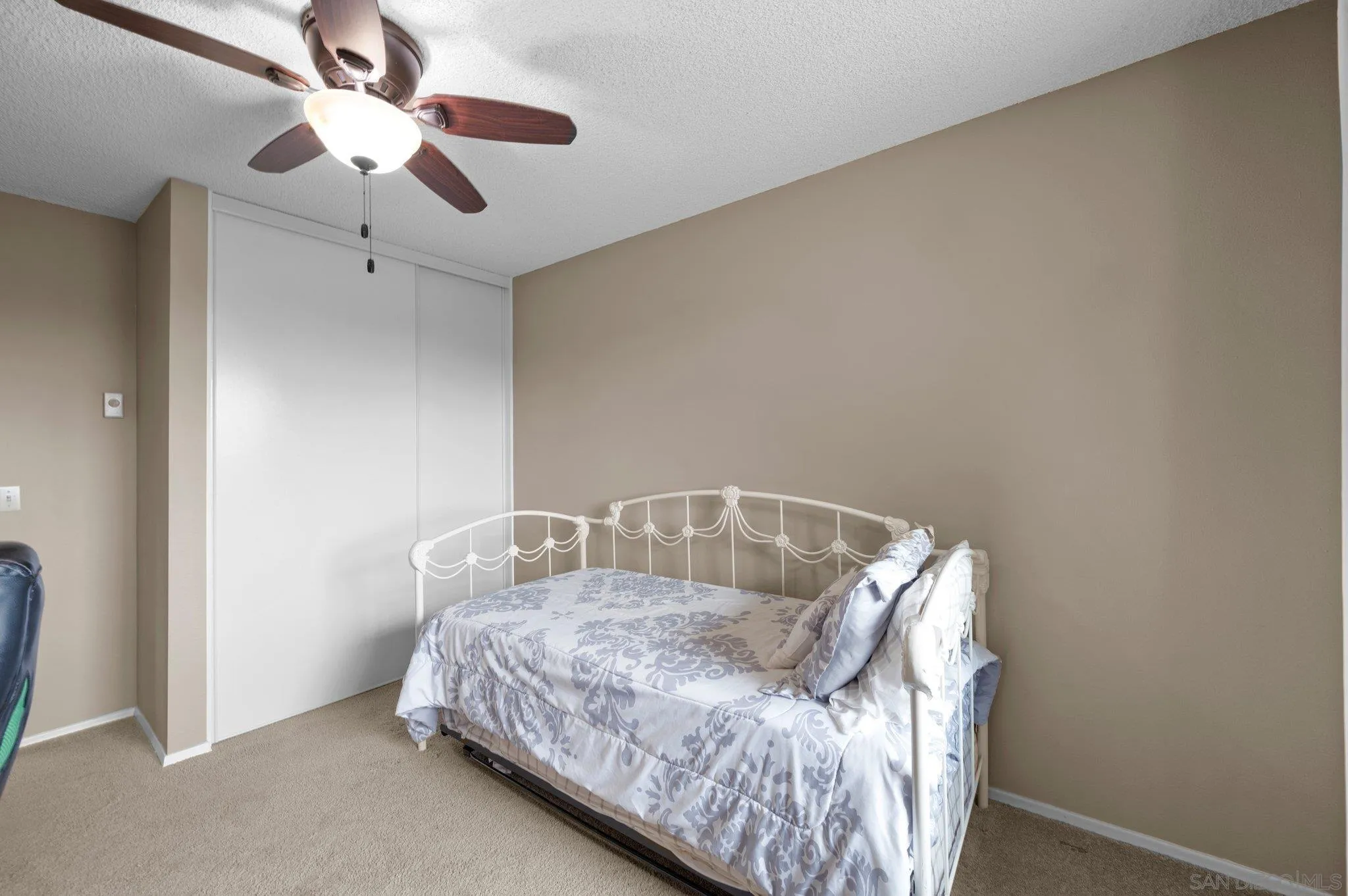 2189 Rockhoff Road Escondido, CA 92026 - Photo 42 of 60 a bed sitting in a room next to a window