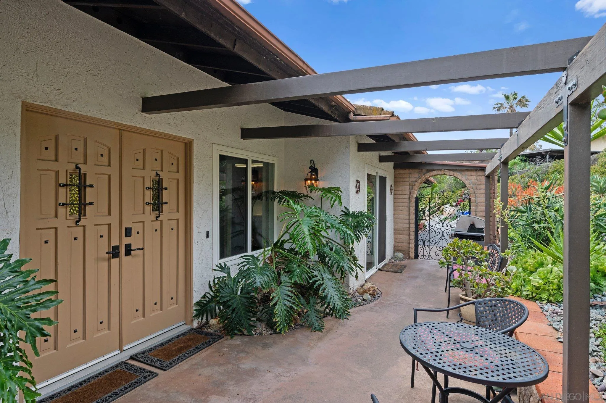 2189 Rockhoff Road Escondido, CA 92026 - Photo 48 of 60 a porch with chairs and potted plants