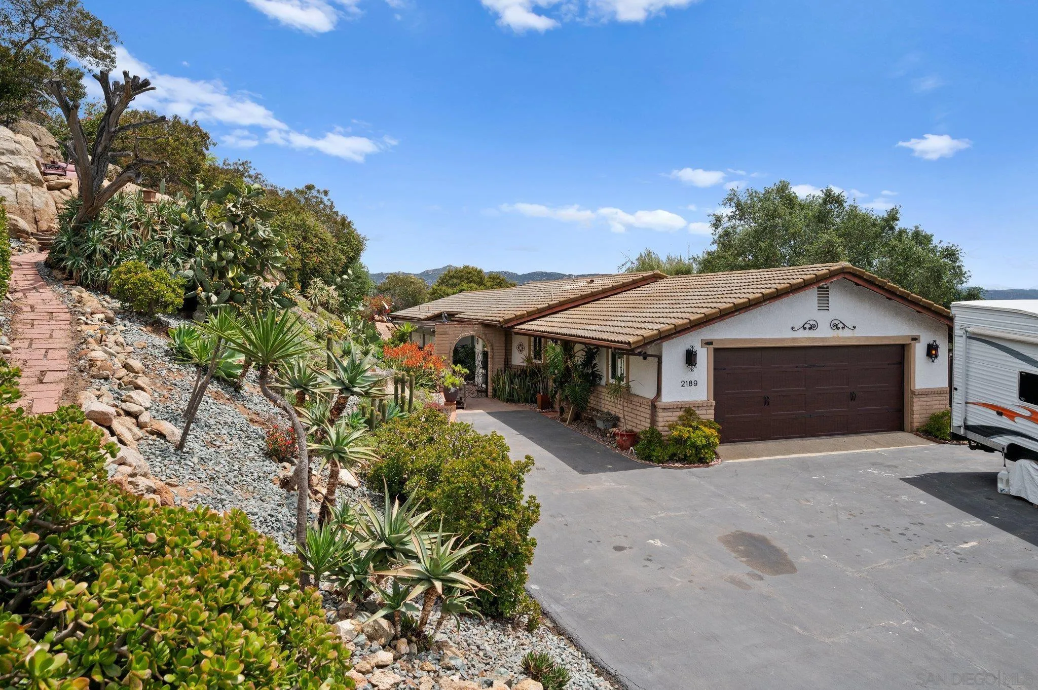 2189 Rockhoff Road Escondido, CA 92026 - Photo 51 of 60 a house with trees in the background