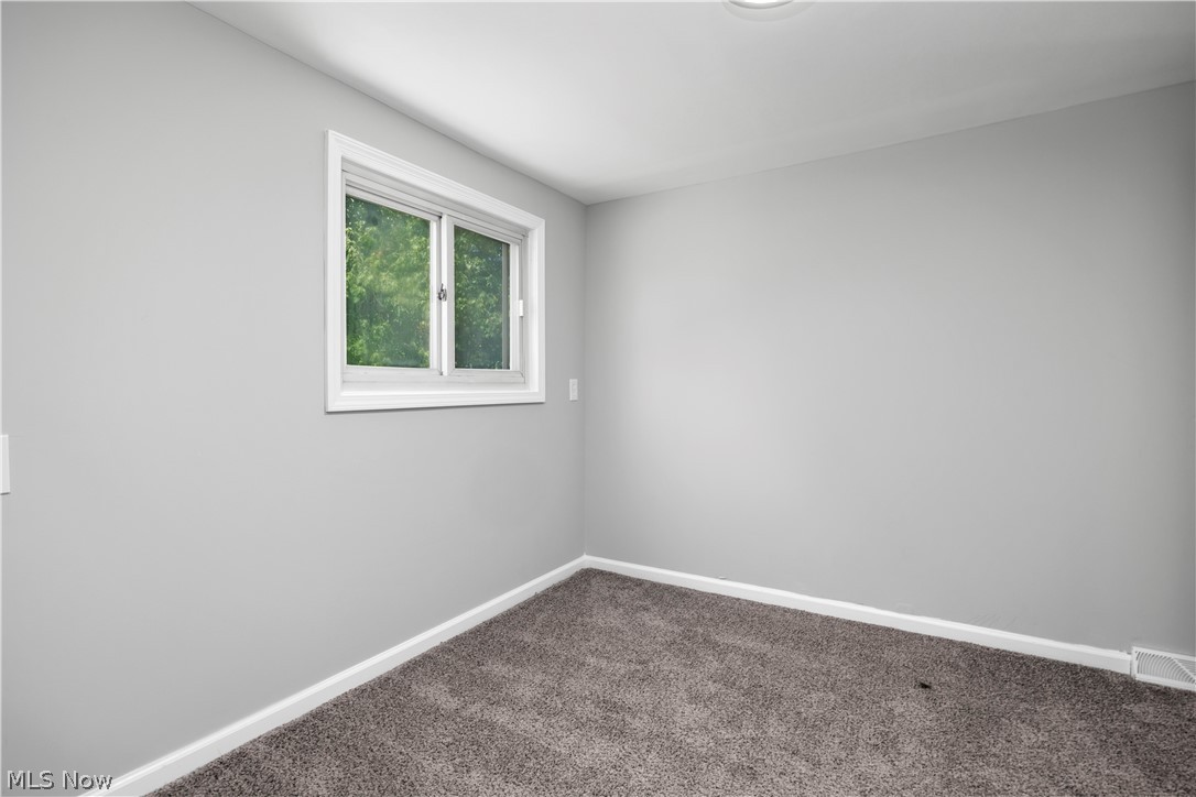 7030 Pearl Road Cleveland, OH 44130 - Photo 32 of 34 Empty room with carpet