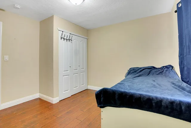 a bedroom with a bed and cabinets