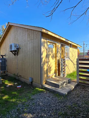 a view of a backyard with garden