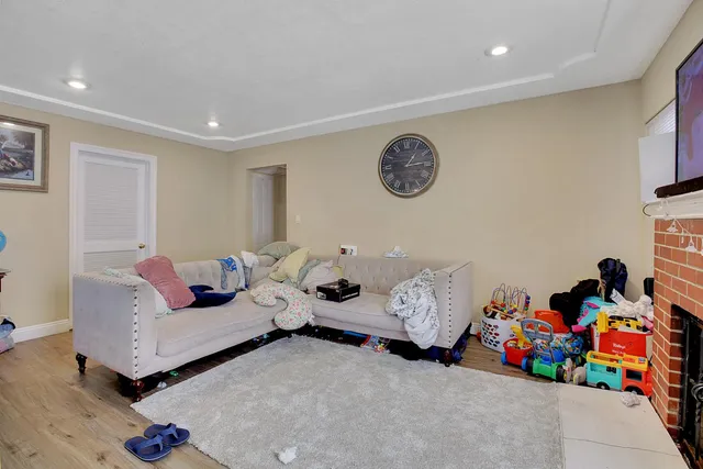 a living room with furniture and toys