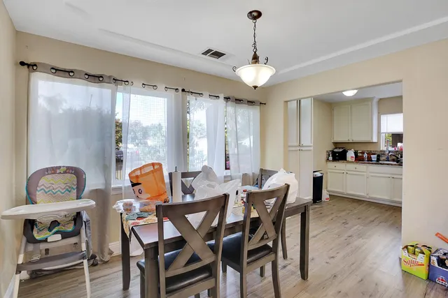 a view of a dining room with furniture window and outside view