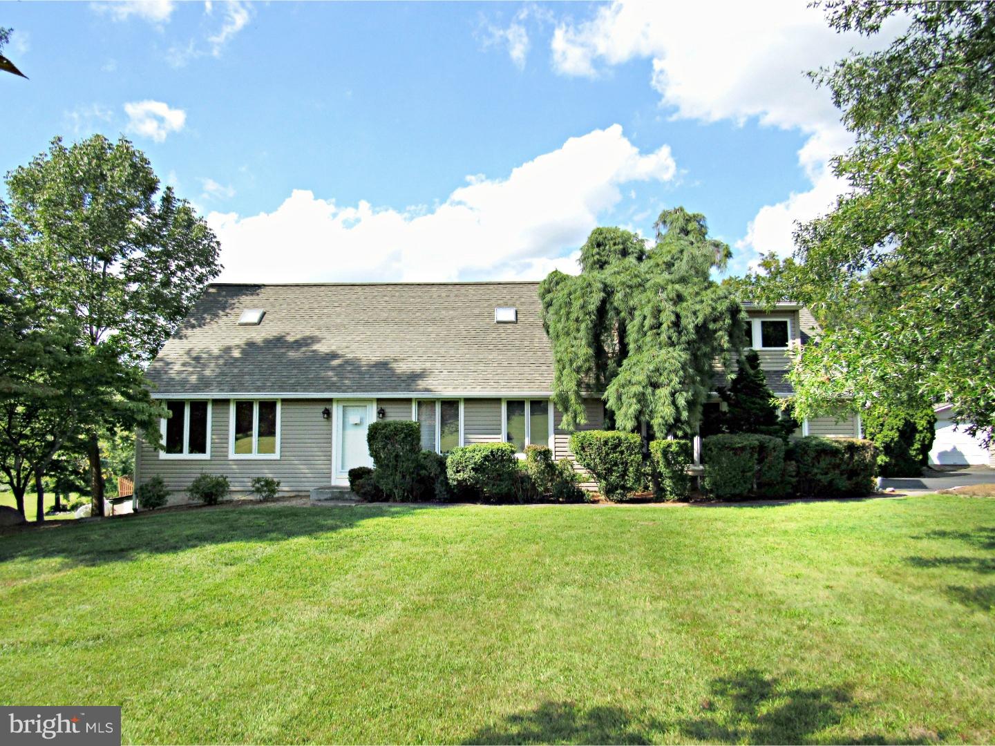 317 Clump Road Green Lane, PA 18054 - Photo 2 of 23 a front view of house with yard and green space