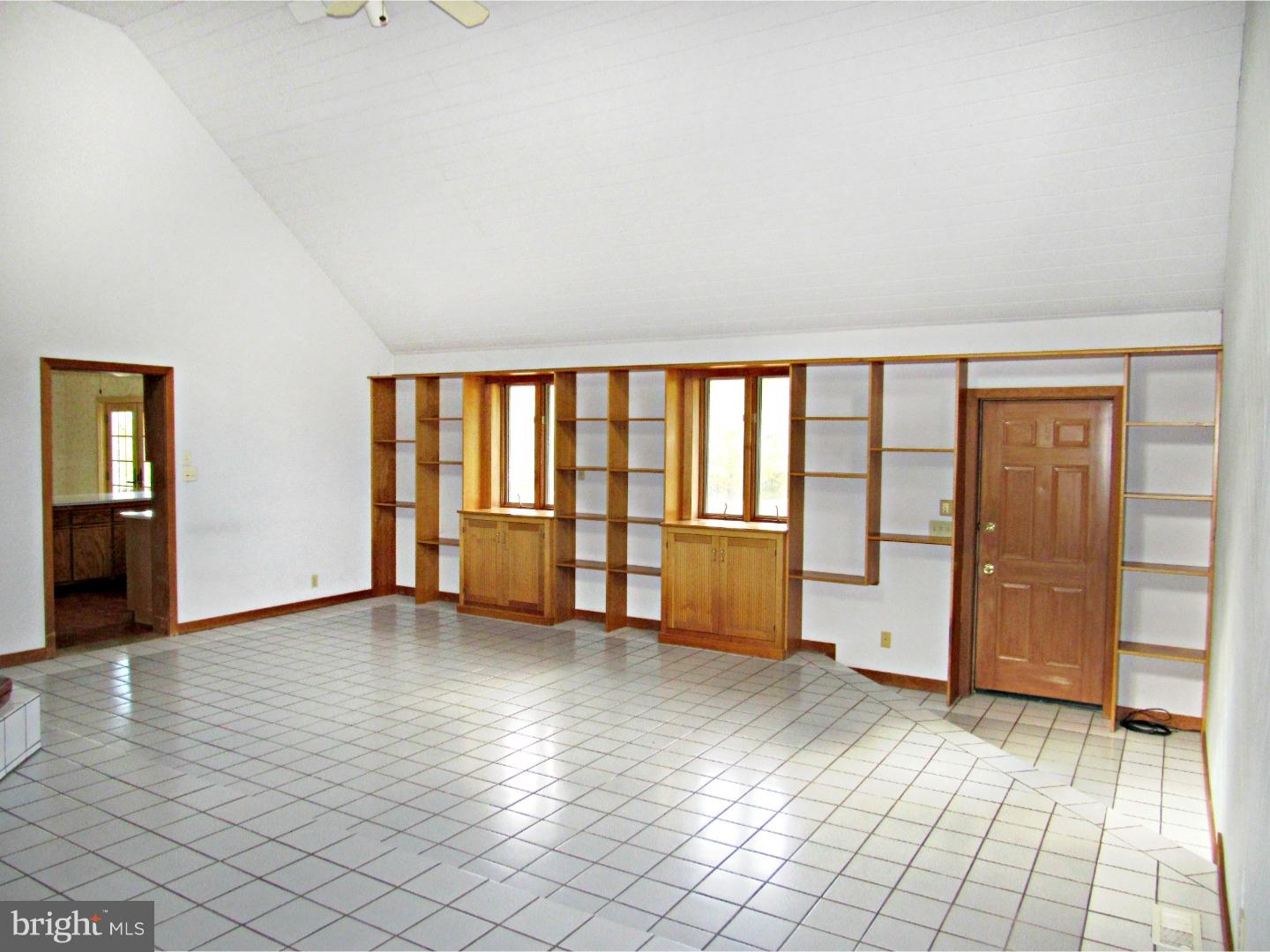 317 Clump Road Green Lane, PA 18054 - Photo 12 of 23 a view of an empty room with window and wooden floor