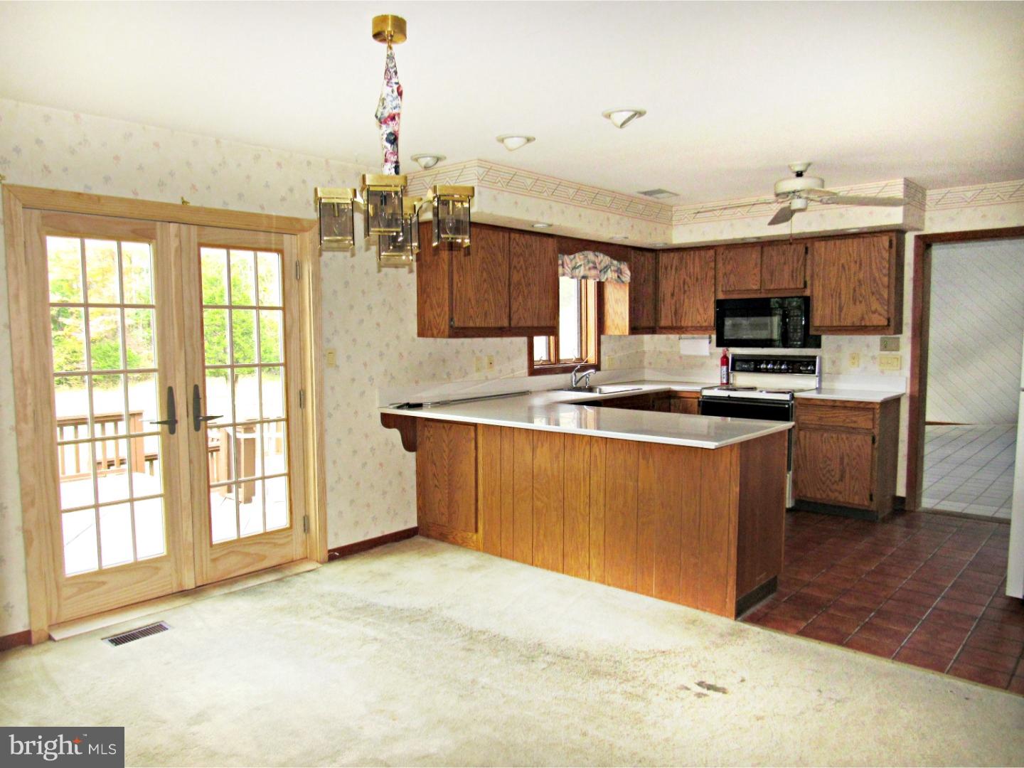 317 Clump Road Green Lane, PA 18054 - Photo 15 of 23 a kitchen with kitchen island a sink appliances and cabinets
