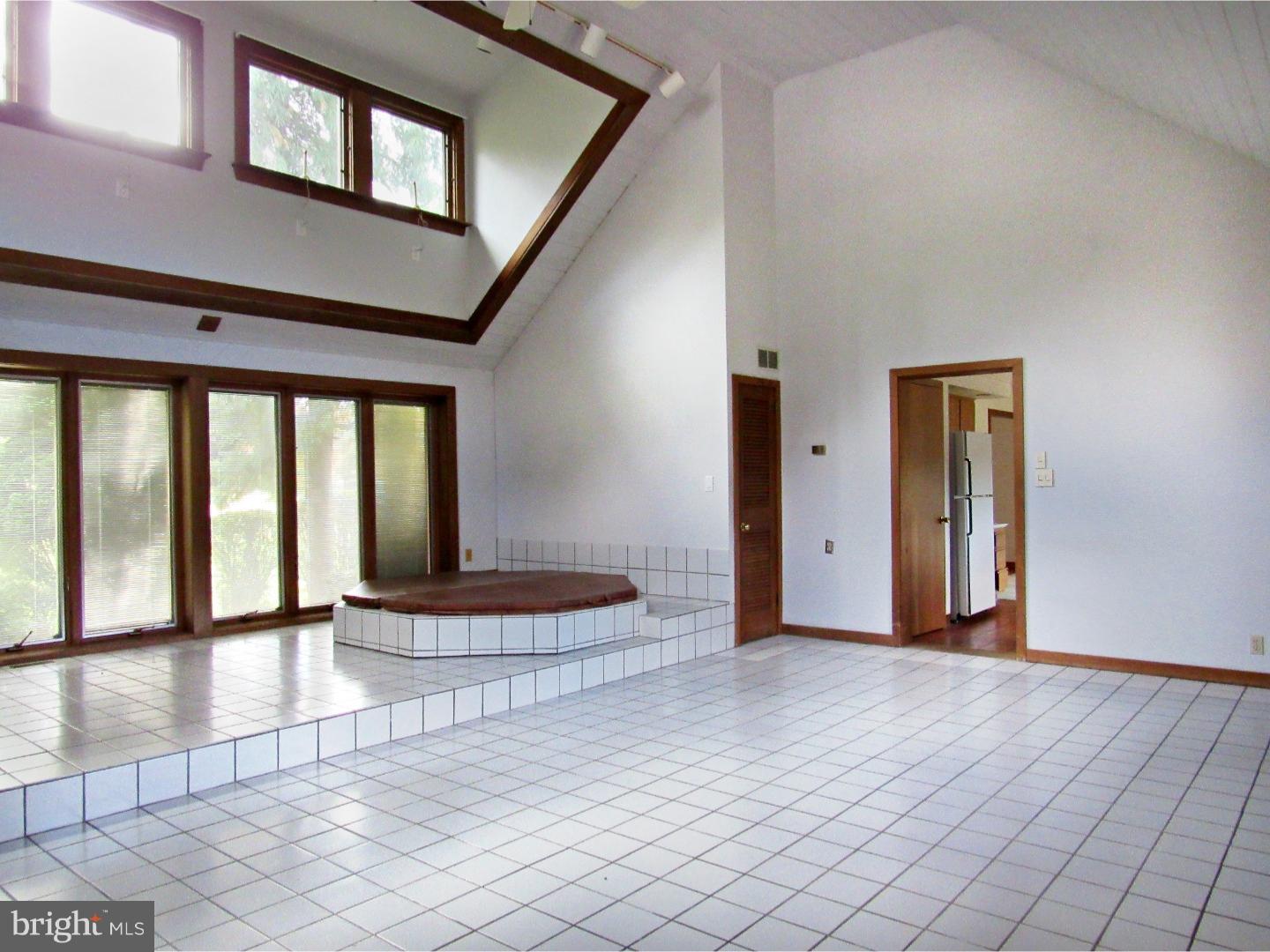 317 Clump Road Green Lane, PA 18054 - Photo 10 of 23 a view of an empty room with window and wooden floor