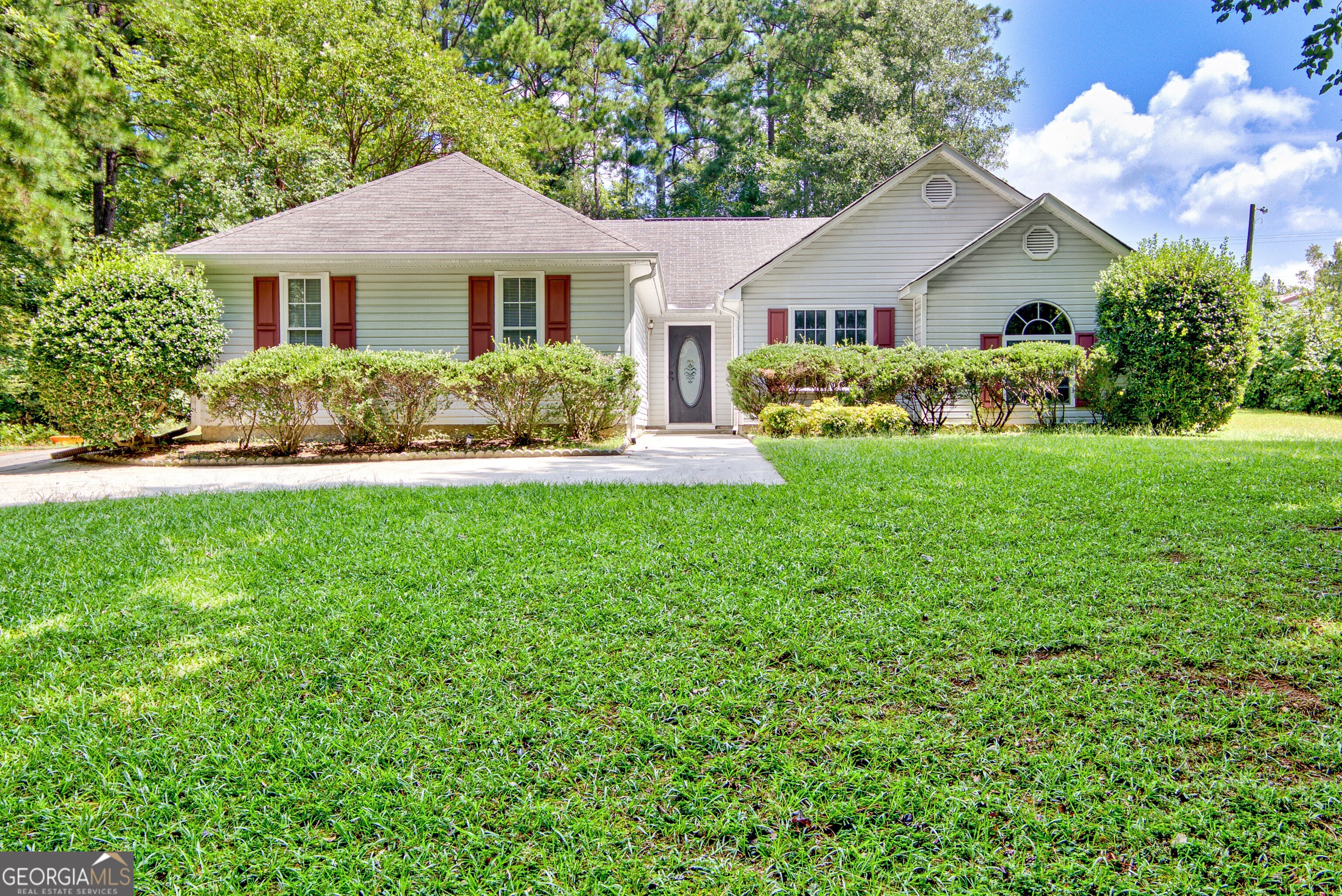 45 Paces Landing Drive Newnan, GA 30263 - Photo 1 of 31 a front view of a house with a yard and trees