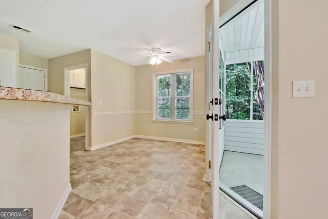 a view of an empty room with a window