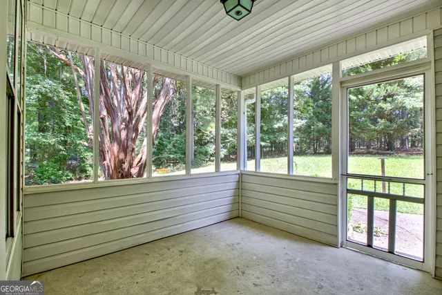 a front view of a house with yard and green space