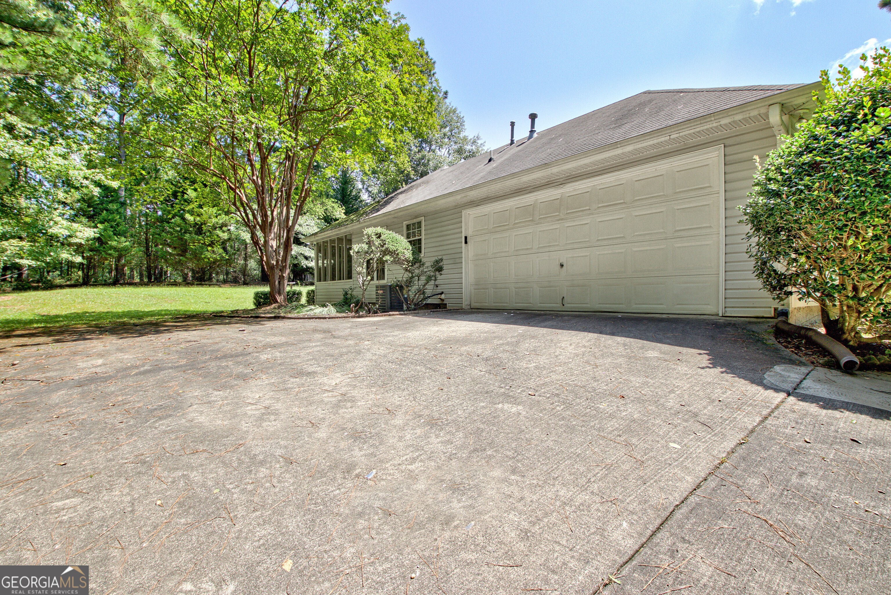 45 Paces Landing Drive Newnan, GA 30263 - Photo 3 of 31 a view of a house with a yard and garage