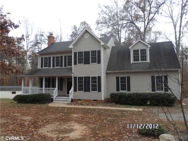 3769 Three Chopt Road Gum Spring, VA 23065 - Photo 1 of 10 a front view of a house with a yard