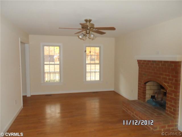 3769 Three Chopt Road Gum Spring, VA 23065 - Photo 2 of 10 a view of empty room with window and fireplace