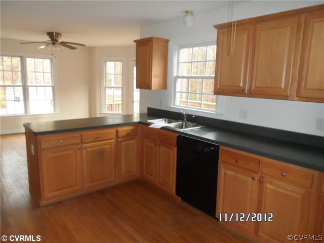 3769 Three Chopt Road Gum Spring, VA 23065 - Photo 5 of 10 a kitchen with granite countertop cabinets sink and window