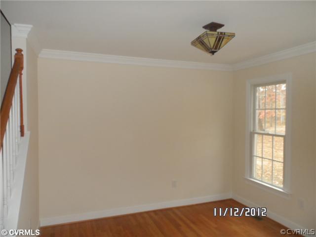 3769 Three Chopt Road Gum Spring, VA 23065 - Photo 6 of 10 an empty room with a window