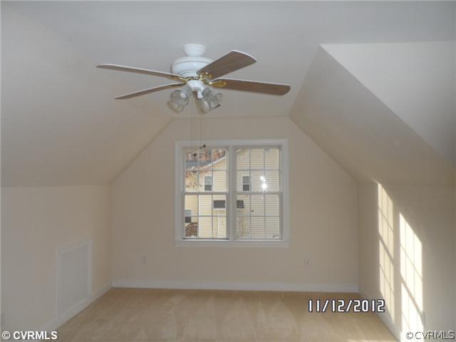 3769 Three Chopt Road Gum Spring, VA 23065 - Photo 9 of 10 an empty room with windows and fan