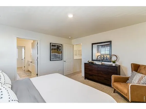 a bedroom with a bed and furniture