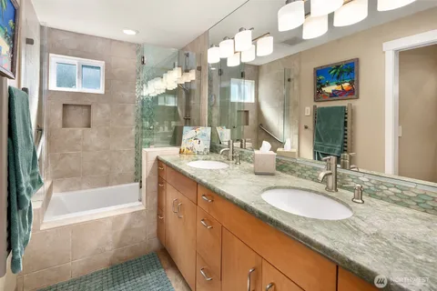 a spacious bedroom with a balcony and large mirror