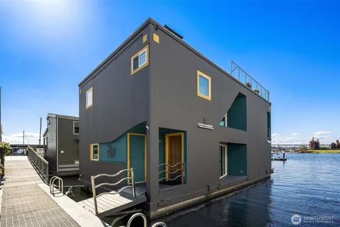 a front view of a house with yard and balcony