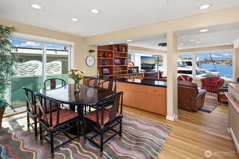 a view of a dining room with furniture and wooden floor