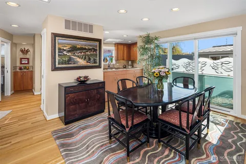 a kitchen with granite countertop a refrigerator stove top oven and sink