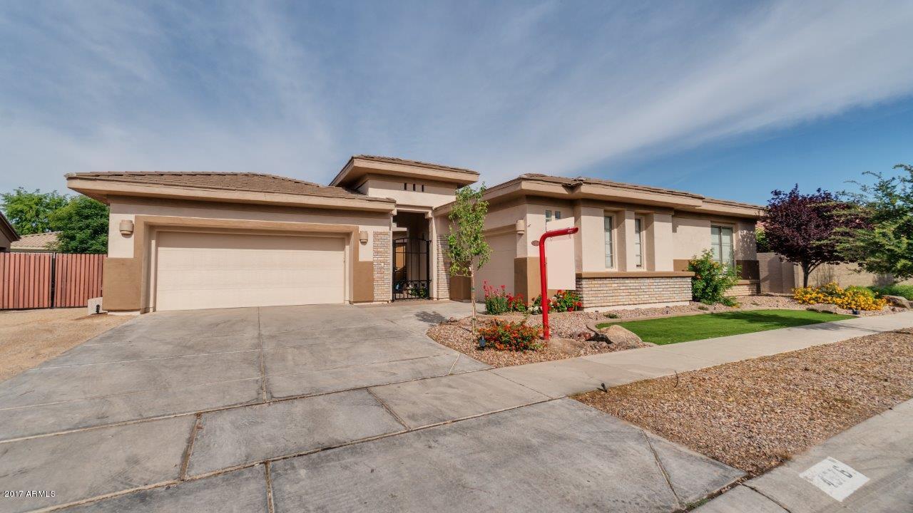 4576 South Ranger Trail Gilbert, AZ 85297 - Photo 1 of 65 a view of a house with backyard and bushes