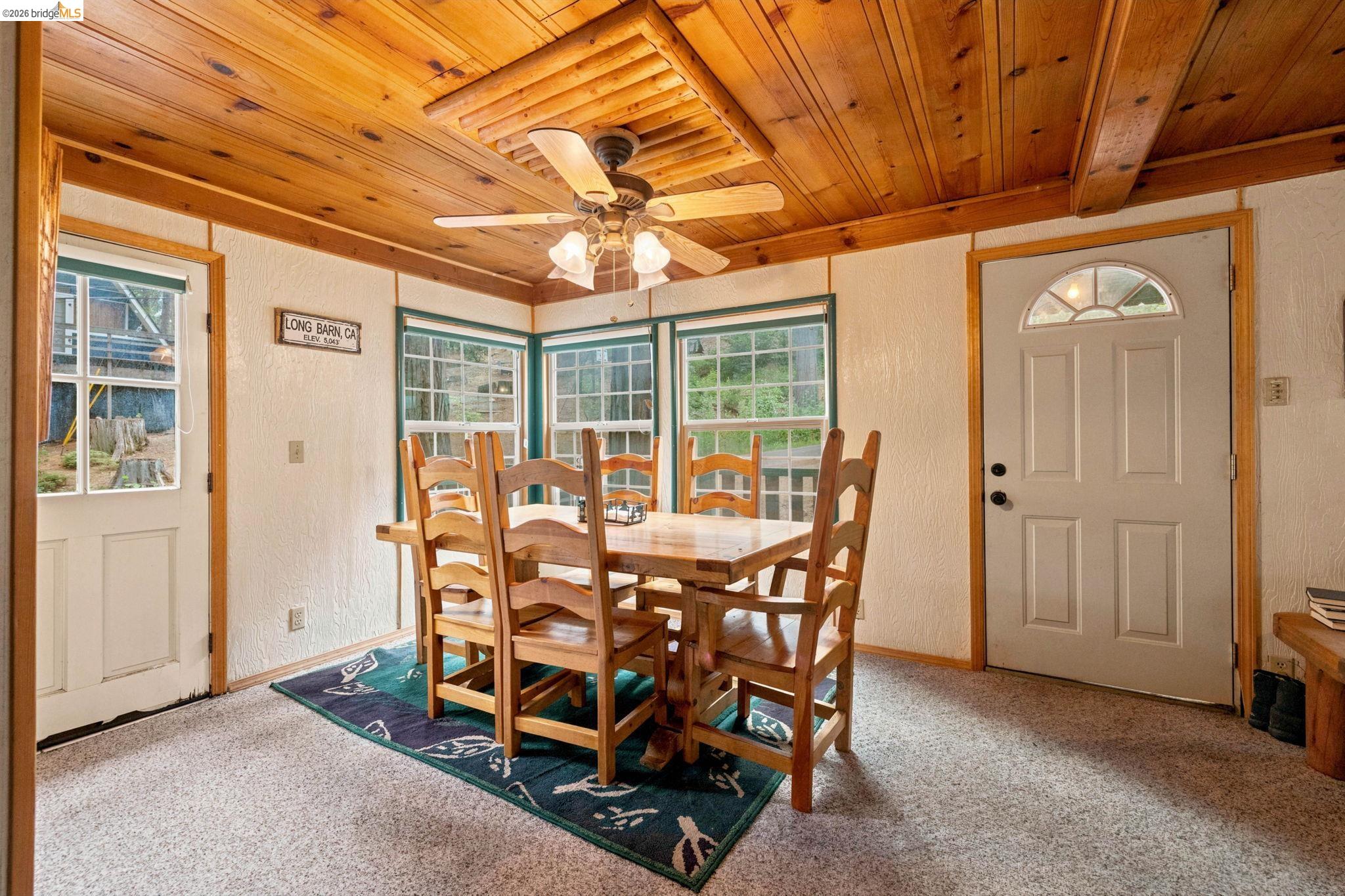 25822 Long Barn Sugar Pine Road Long Barn, CA 95335 - Photo 2 of 28 a view of a dining room with furniture window and outside view