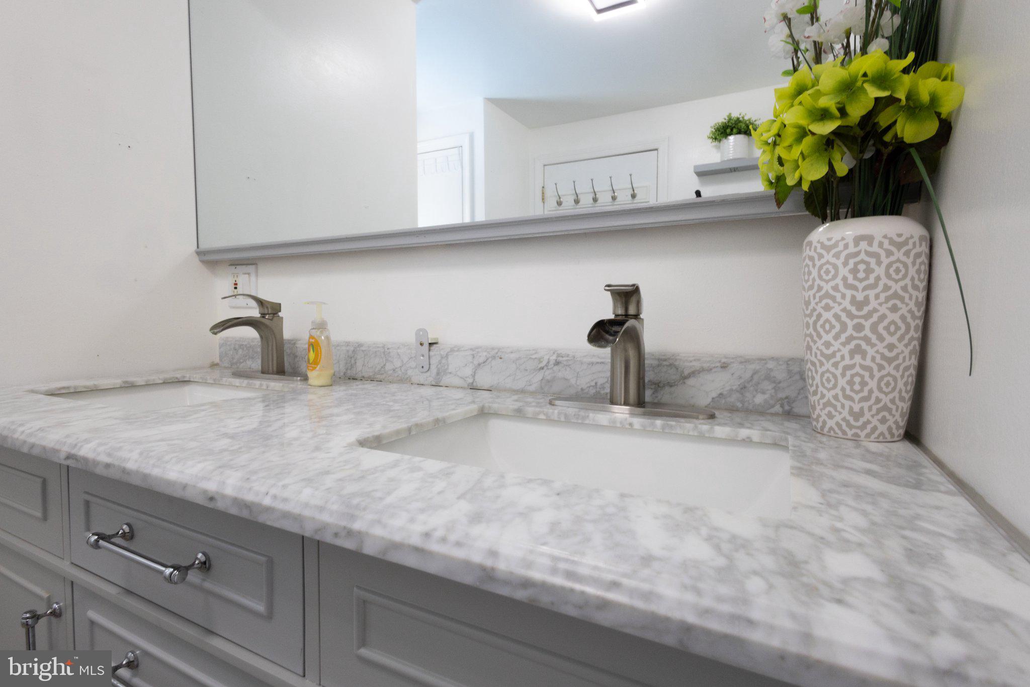 109 Rutgers Avenue Bridgeton, NJ 08302 - Photo 26 of 43 Elegant marble vanity with modern fixtures.
