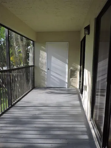 a view of backyard and tree