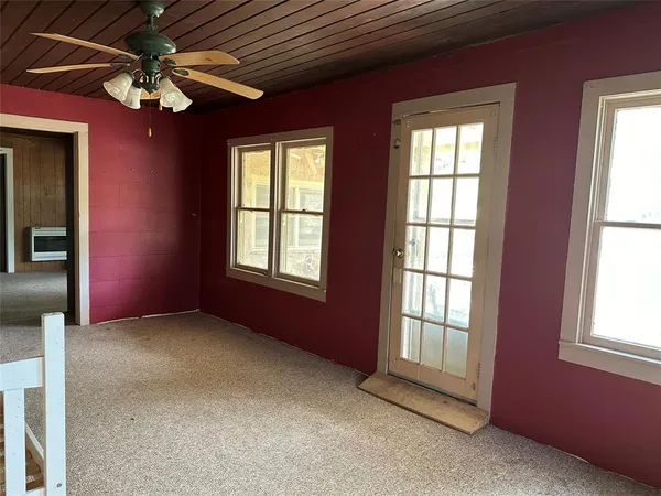a view of livingroom with a ceiling fan and window