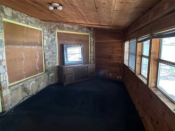 a view of an empty room and window