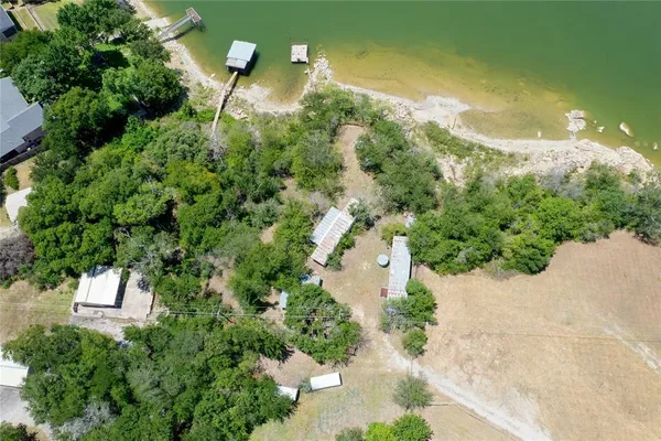 an aerial view of a house with a yard
