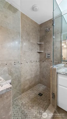 a bathroom with a shower and a sink