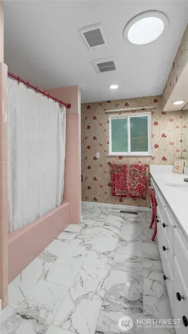 a spacious bathroom with a granite countertop sink a mirror and shower