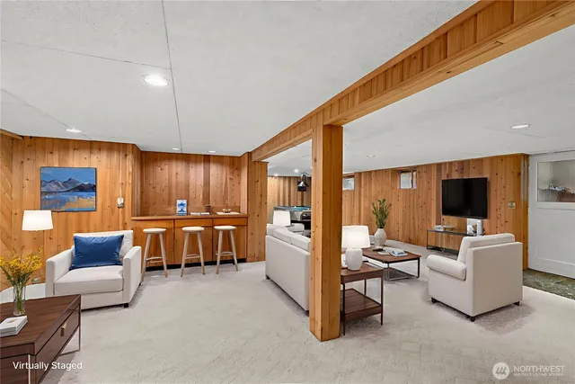 a living room with fireplace furniture and a flat screen tv