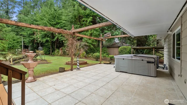 a view of a backyard with sitting area