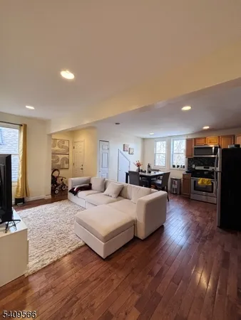 a bedroom with furniture and a flat screen tv