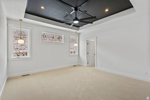 728 East Mountain Road North Ogden, UT 84414 - Photo 10 of 28 Recessed ceiling featuring a black tray design with a modern ceiling fan and integrated lighting