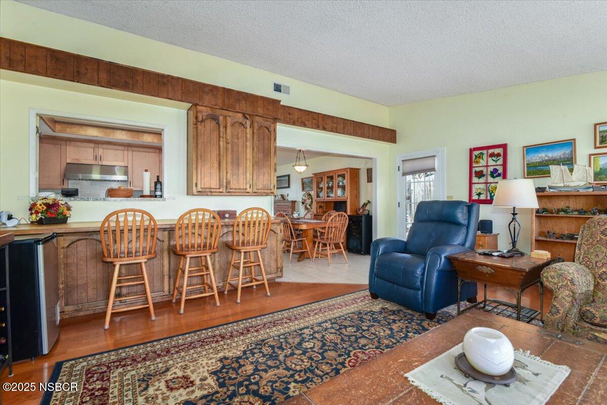3987 Agena Way Lompoc, CA 93436 - Photo 15 of 40 a living room with furniture a rug and a table