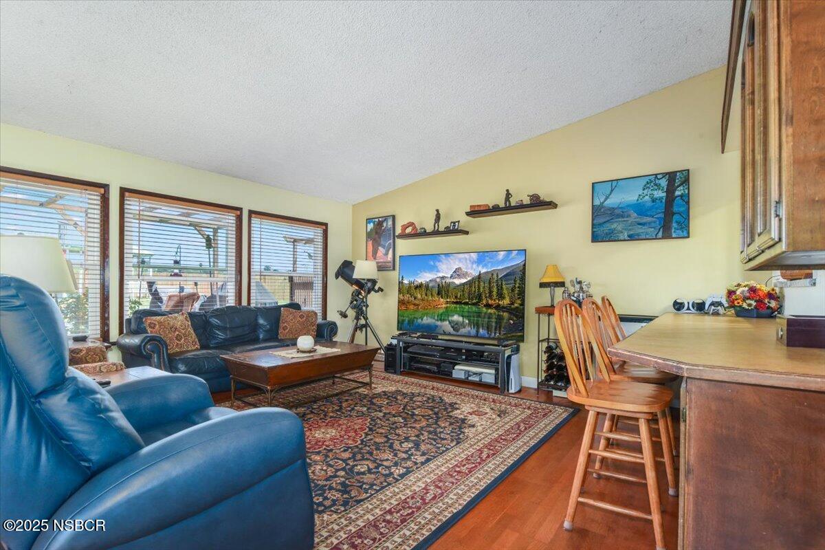3987 Agena Way Lompoc, CA 93436 - Photo 16 of 40 a living room with furniture and a flat screen tv