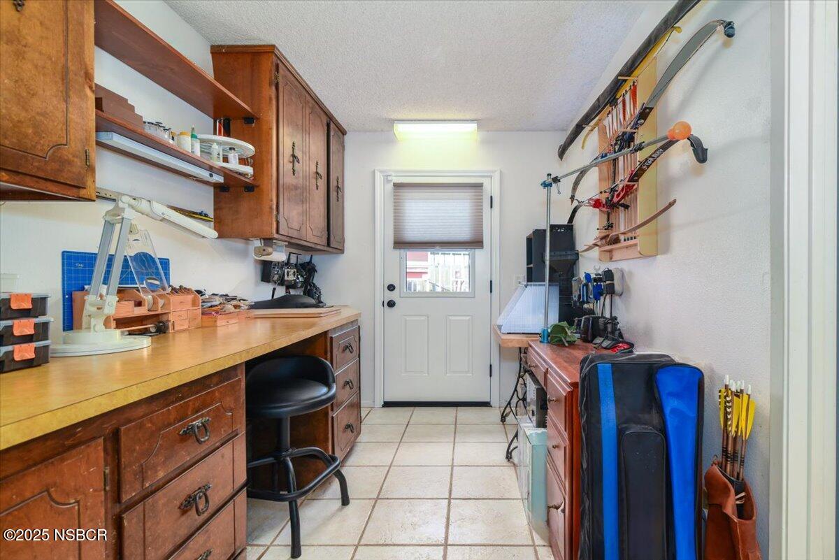 3987 Agena Way Lompoc, CA 93436 - Photo 24 of 40 a kitchen with a sink cabinets and utility