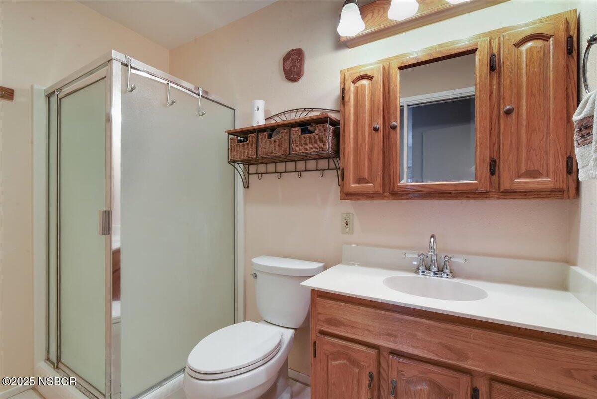 3987 Agena Way Lompoc, CA 93436 - Photo 29 of 40 a bathroom with a sink a toilet and shower