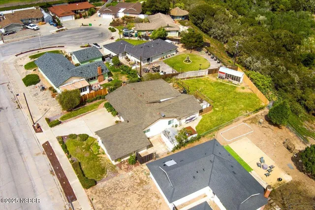 an aerial view of a house with swimming pool