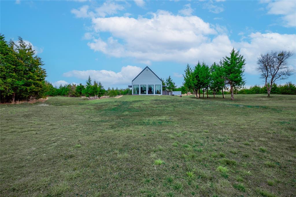 511 County Road 4264 Bonham, TX 75418 - Photo 40 of 40 a front view of a house with a yard and trees