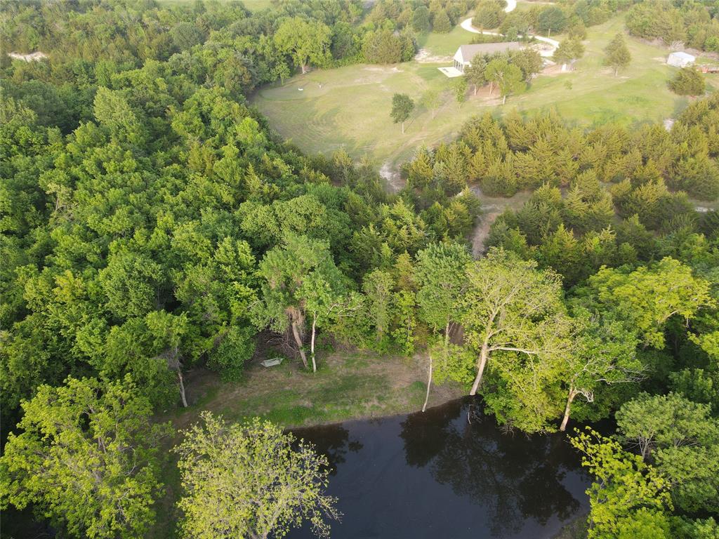 511 County Road 4264 Bonham, TX 75418 - Photo 5 of 40 a view of a lake view with sitting space