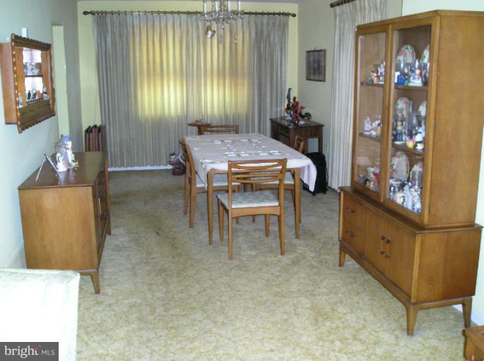 6813 Queens Ferry Road Baltimore, MD 21239 - Photo 12 of 19 a room with furniture and window